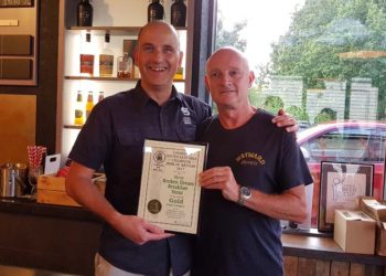 Pictured left: Darron Anley is pictured receiving his award from CAMRA’s brewery liaison officer Kevin Lenton