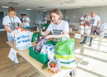 Volunteers help package food parcels for the vulnerable. Picture: Stewart Turkington