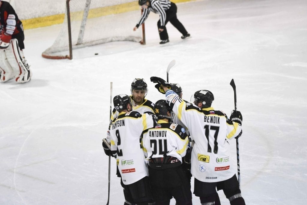 Team-mates congratulate Thompson (far left) after making it 4-3 on Sunday night (Picture: Bob Swann)