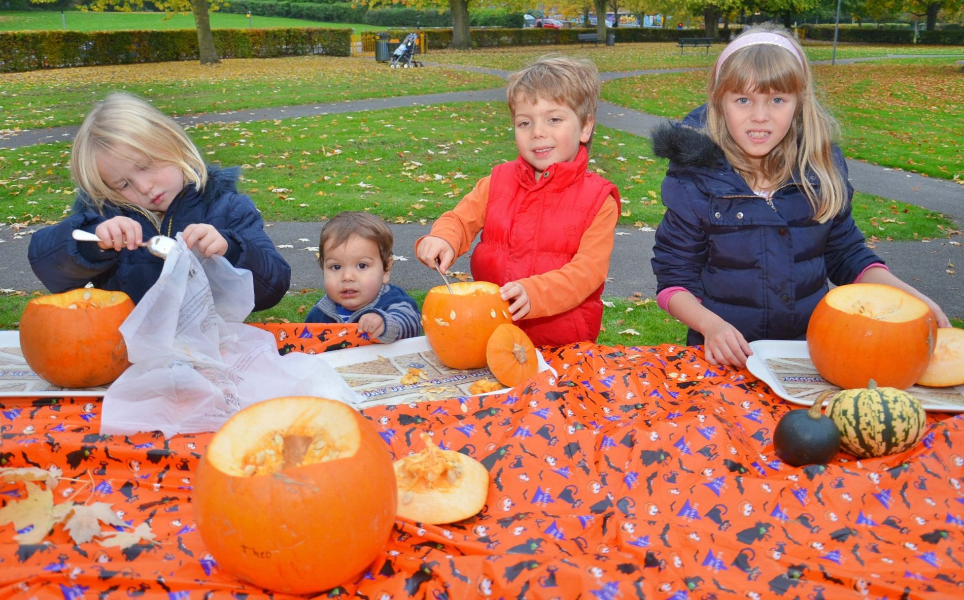 Children carving their Pumpkins