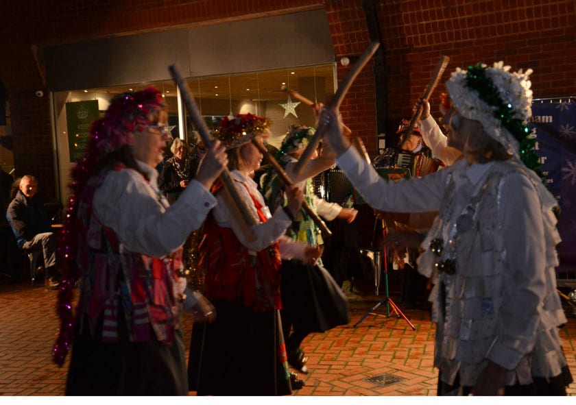 Dancing to we wish you a merry Christmas a grand display shinnfield Shambers outside Brown Jug in Wokingham