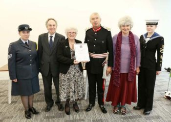 EVDB receiving their Queens Award nomination from the Lord Lieutenant
