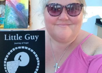 Emma Major with a copy of Little Guy, her newest book