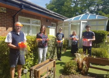 The group delivering their face visors to Age Concern