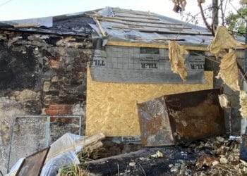 The building has been blackened from the fire, with damage to the roof and external walls. Picture: Phil Creighton