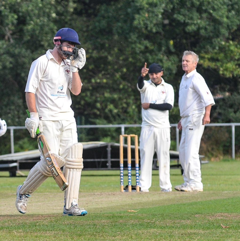 Emmbrook & Bearwood 2s v Denham 2s (batting) Bowler, Geoff Marsden appeals to the umpire and the umpire decides it's out.