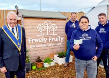 From left: John Pegler presents a cheque,  on behalf of the Berkshire Masonic Charity, to Matt Knight, Ryan Simpson and James Whittingham of Freely Fruity on Saturday Picture: Steve Smyth