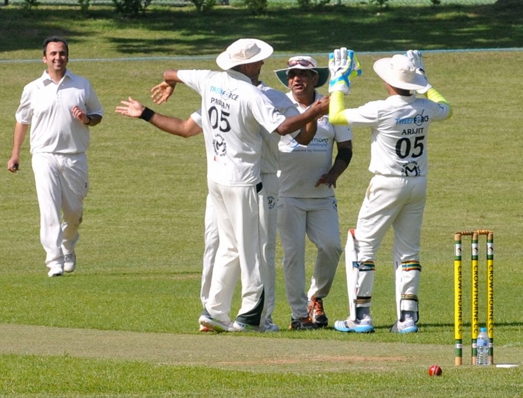 Crowthorne & Crown Wood 2s (batting) v Shinfield 2s Shinfield celebrate taking a wicket.