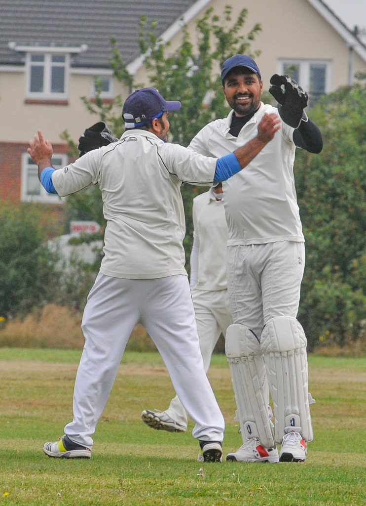 Earley CC (batting) v Woodley CC 2s Woodley celebrates taking a wicket.