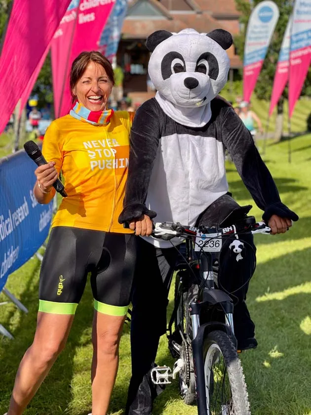ALL SMILES FOR THE PANDA: Davina McCall with the Earley Panda at the Big Sussex Bike Ride