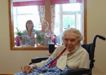 Lord Harris Court resident, Margaret Bradley is reunited with her daughter, Meriel, and her granddaughter Hannah in their new visitor room.