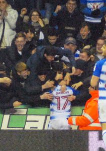 Mo Barrow jumps into the crowd to celebrate his goal