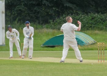 Paul Dewick bowls and catches to remove Russell Petley