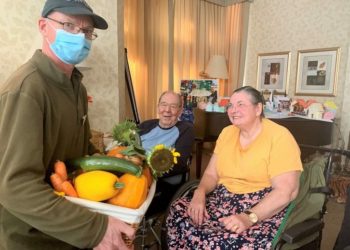 Gardener Graham Hoyle and residents Michael Mace and Ann Molet with a basket of vegetables picked from the home’s garden