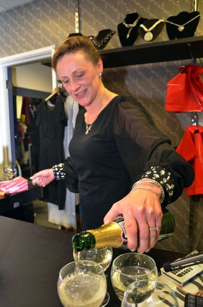 The woner of CODE in Peach Street serving up the bubbles