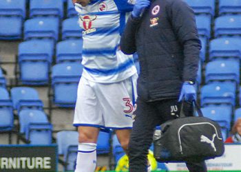 Tommy Elphick is forced off with a knee injury