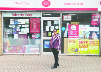Leena Dattani standing outside her Post Office on Harpton Parade.