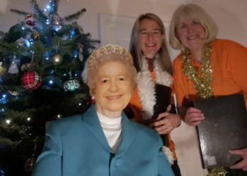 Carol singers and Nasio charity supporters Sophie Vyse (centre), who supplied the voice for “The Queen”, Gill Leishman and Margaret Walker (“The Queen”) are part of the same bubble in Wokingham/Hurst