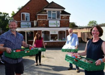 Foodbank manager Annette Medhurst, right, and volunteers with the donation. Picture by Baratt and David Wilson Homes