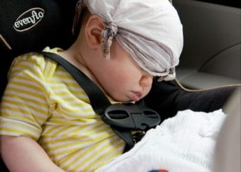 baby sleeping in car journey