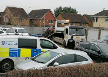 Police attending car removal in Lowfield Road, Caversham Park Village on Sunday. Picture: Steve Smyth