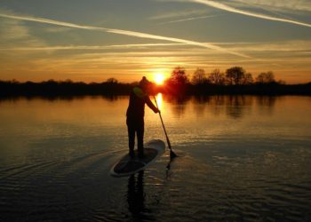 A paddleboarder enjoys a sunset event at Dinton Pastures Picture: Wokingham Borough Council