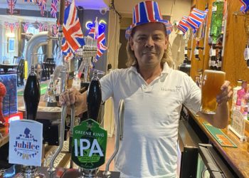 Dave Rigg, landlord of The Roebuck, raises his 6p pint to the Queen Picture: Phil Creighton