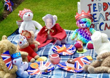 The Queen relaxes with friends in the garden. Picture Emma Merchant