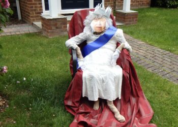 The scarecrow Queen surveys her subjects from the comfort of the front lawn in Emmbrook. Picture: Emma Merchant
