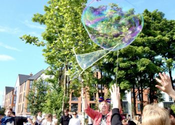 Jumping for bubbles on Elms Field. Picture: Emma Merchant
