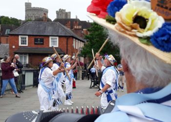 Is that the Queen waving from the Windsor Castle tower? Maybe she did spot Hurst Morris People dancing on Eton Bridge over the Thames.