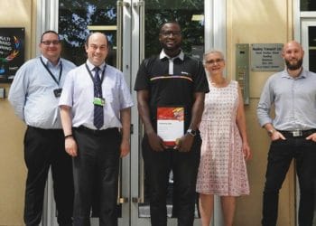 Kwabena Addo with his Star of the Month award from Reading Buses