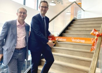 InstaGroup?s David Robson watches as Bristol North West MP Darren Jones cuts the ribbon to open the new InstaGroup HQ in Hogwood Industrial Park in Finchampstead Picture: Phil Creighton