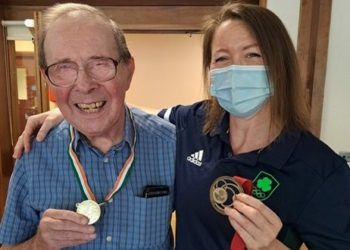 Megan Fletcher presented a medal to 78-year-old Michael Holdstock at Lord Harris Court in Sindlesham