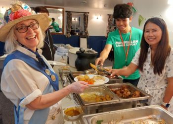 Hurst Morris People dancer Sheila Cook being served tasty Thai food by Leo Bello, 13, and Yuti Ellis. Pictures: Sue Corcoran