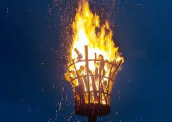 A blazing beacon commemorates the Queen?s life, despite pouring rain Picture: Sue Corcoran