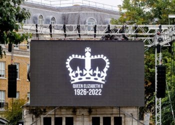 The Funeral Service of the Queen on a large screen in the Forbury Gardens.