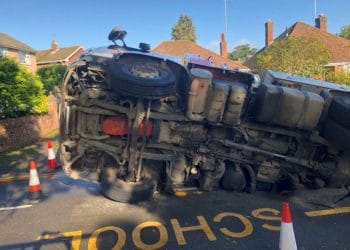 A sinkhole has opened in Evendons Lane, and a lorry is trapped in it Picture: Jim Kerr