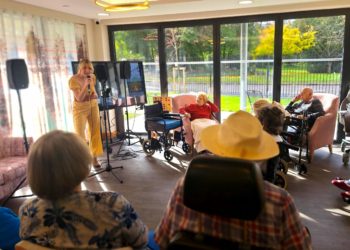 Residents at RMBI Care Co. Home Prince Philip Duke of Edinburgh Court, in Wokingham, enjoy Emily?s performance, who sang some of the most famous tunes by American actress and singer Doris Day