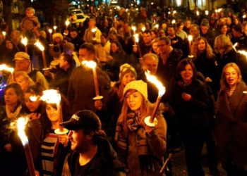 The torchlit procession will leave from Market Place. Residents carry flaming torches in the 2015 event. Picture: Phil Creighton