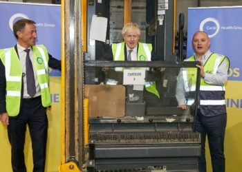 Circle CEO Paolo Pieri, left, and former prime minister Boris Johnson, centre, at the Enfield warehouse. Picture: Zoe Norfolk, courtesy of Circle Health Group