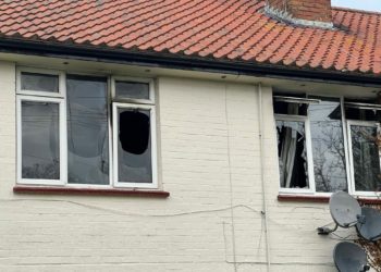 Windows were left smashed after a fire at a Frensham Green flat. Picture: Ji-Min Lee