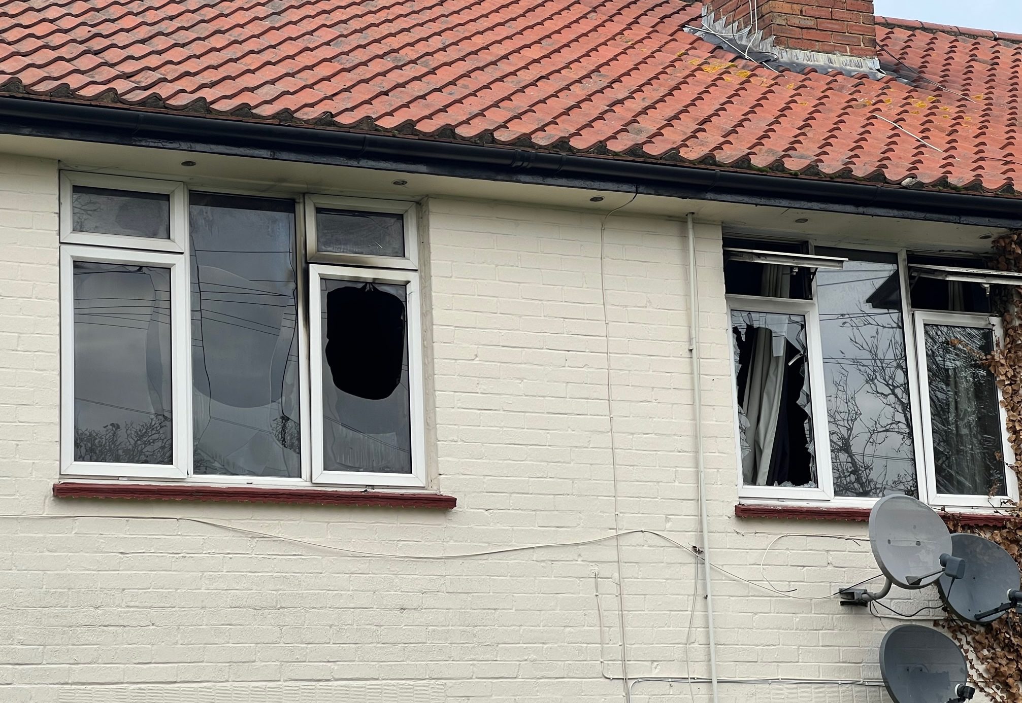 Windows were left smashed after a fire at a Frensham Green flat. Picture: Ji-Min Lee