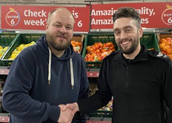 Wokingham Aldi store manager Craig Breadmore with PS Paul Bentley celebrating the launch of Shopwatch Picture: Phil Creighton