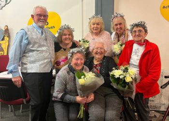 Maggie Hibbit (back row, second from left) and the afternoon tea's organising committee celebrated its final meeting before Christmas. Picture: Ji-Min Lee