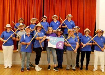 In 2022, Hurst Morris People (pictured in winter kit) supported Wokingham?s First Days charity. First Days Outreach Manager, Lindsay Browne, received the cheque from Hurst Morris Squire, Karen Ricketts