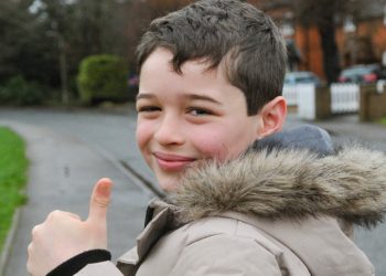 Ten year old Finley Rockall-Howells walking the streets of Woodley to raise money for charity. Picture Steve Smyth