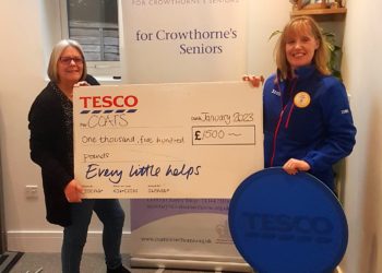 Louis Jedras of Tesco Wokingjam presenting a cheque for £1,500 Picture: COATS