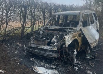 The aftermath of a suspected arson attack in Hurst. The vehicle was a Range Rover