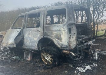 The aftermath of a suspected arson attack in Hurst. The vehicle was a Range Rover